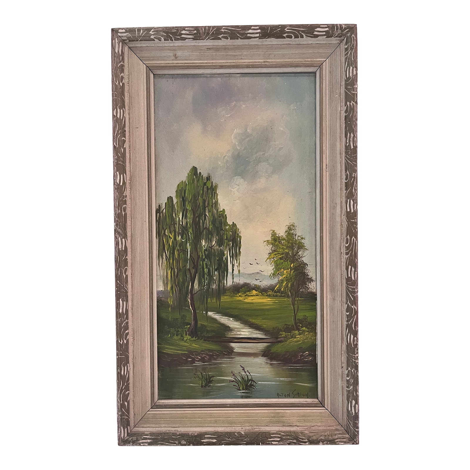 Vintage Signed Landscape Oil Painting on Board, Circa 1960s: A charming vintage landscape oil painting depicting a peaceful countryside scene with a meandering stream, willow tree, footbridge, and distant birds beneath a dramatic sky. Rendered in rich greens