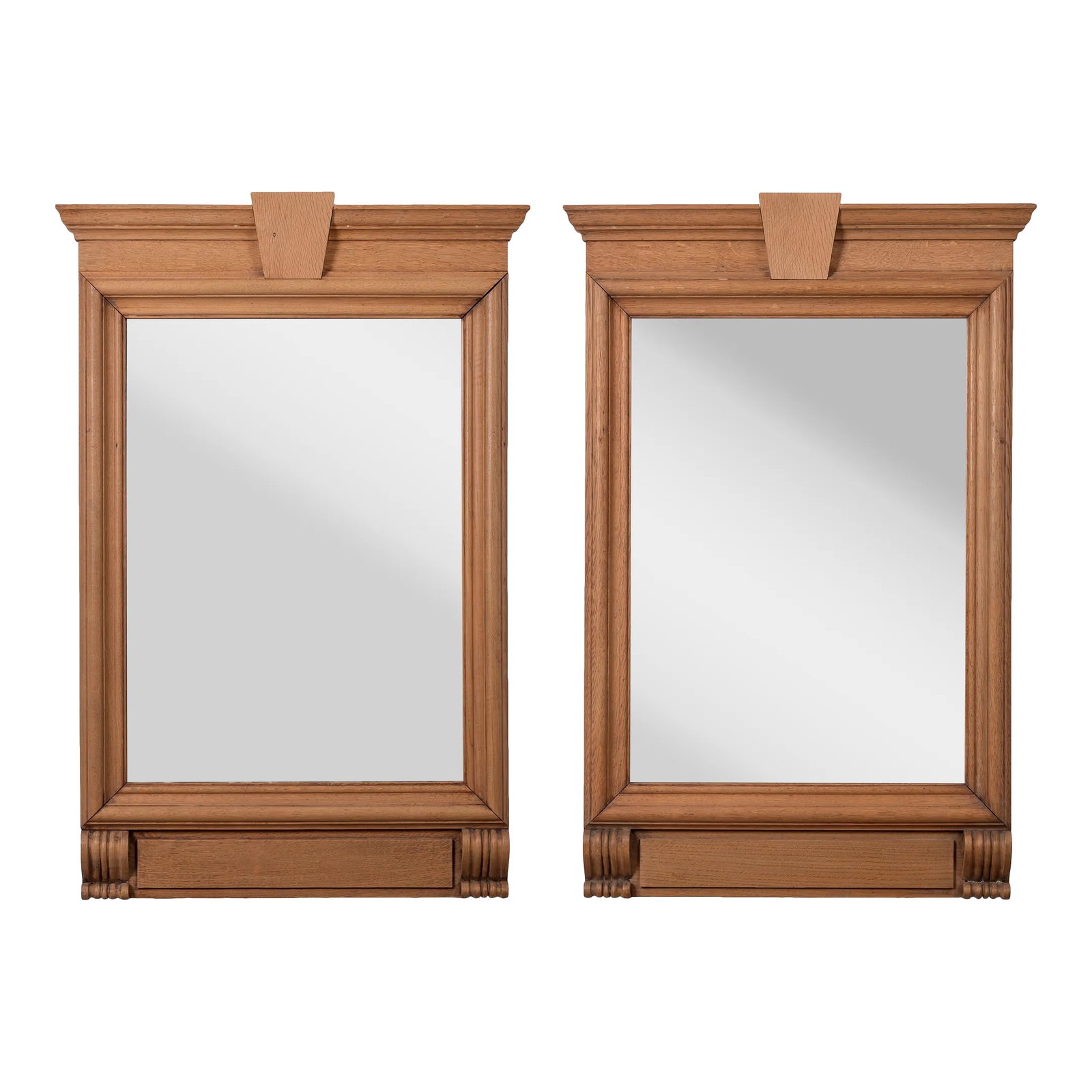 French Neoclassical Style Limed Oak Trumeau Mirrors, 19th Century - a Pair: A pair of French neoclassical style limed oak trumeau mirrors, 19th century. Antique plates; molded cornice above linear frames supported by two carved brackets. 28 3/4 inches wide by 43 inches tall