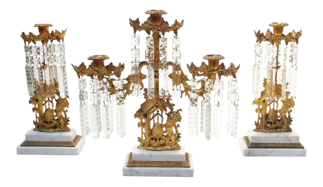 Set of French Gilt Metal and Crystal Girandole Candelabra With Bear Motif: Rococo girandoles composed of gilt metal with stepped marble bases and etched lead-crystal prism decoration (ca. late 19th Century, France). The centerpiece candelabra features three branching arms ac