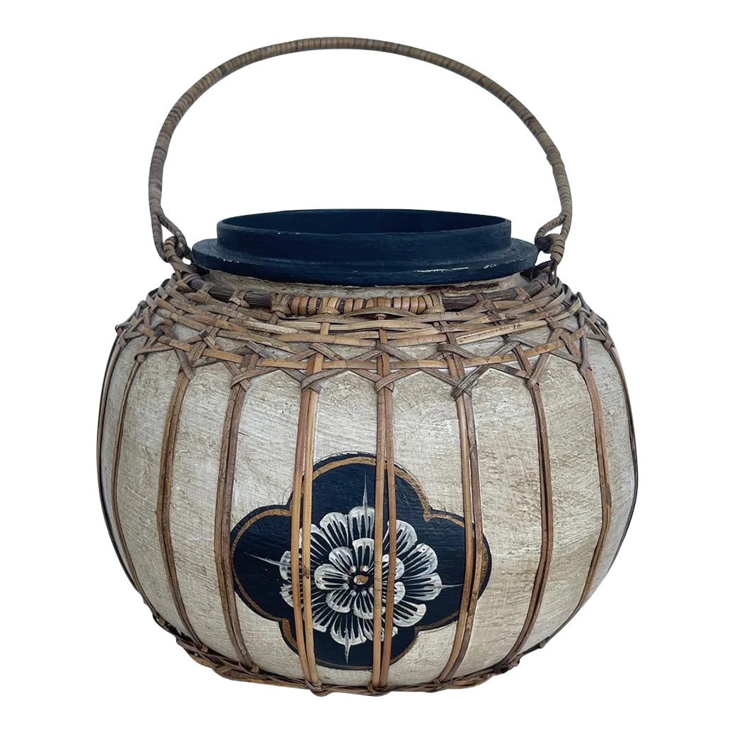 Vintage Asian Paper Mache Rattan Wrapped Container With Handle: Vintage Asian Paper Mache Storage Container with wrapped rattan design and handle. Beige with black flower print and black wood base. I don't know if it there was a lid or not. Would look great with a