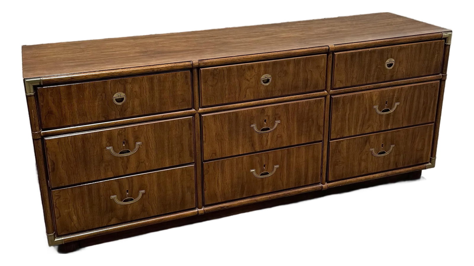 Vintage Accolade Campaign Dresser by Drexel: A timeless piece from Drexel's celebrated Accolade collection, this vintage campaign dresser embodies refined craftsmanship and sophisticated mid-century design. Rich wood grain veneers are beautifull