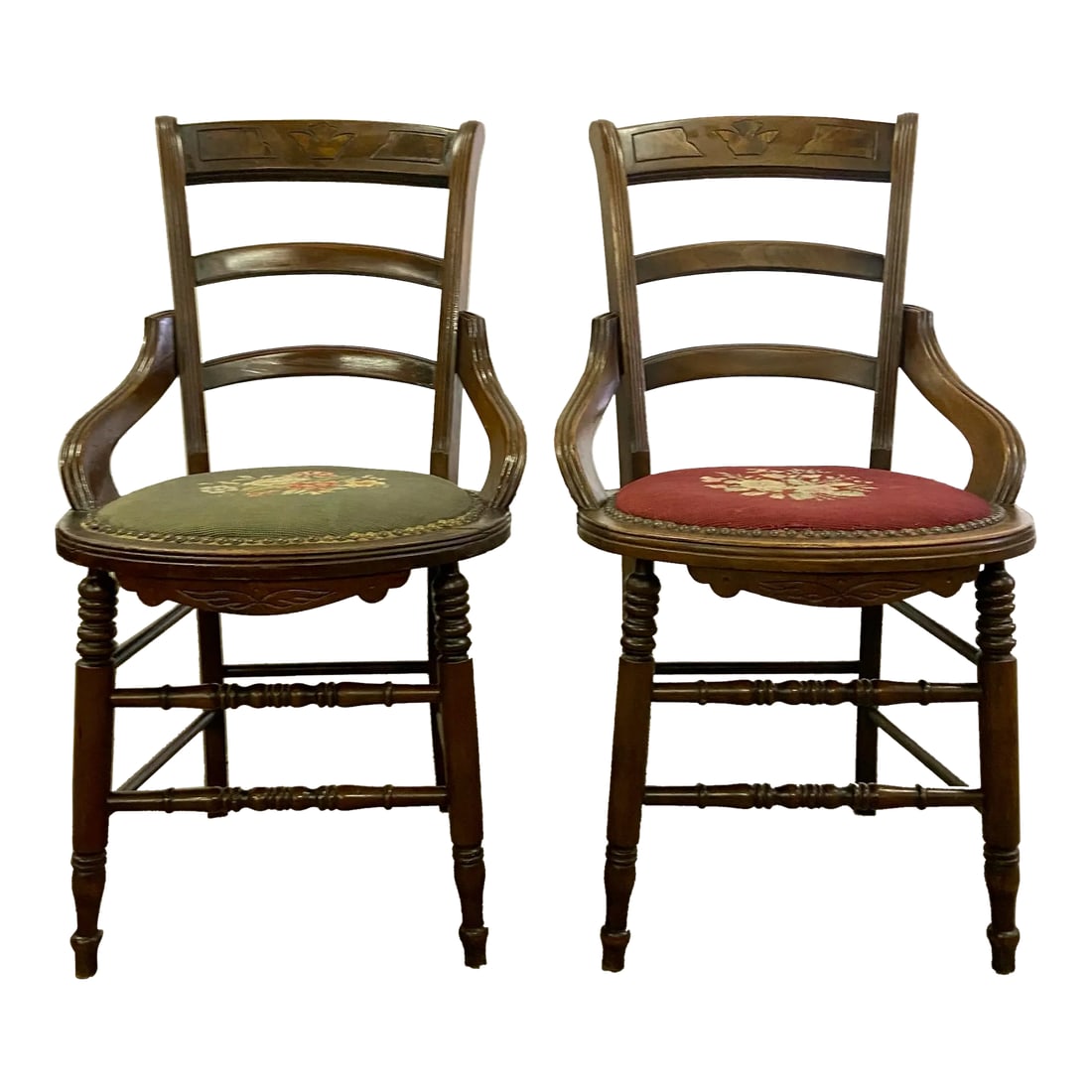 Antique 19th Century Victorian Needlepoint Ladderback Chairs - Pair: This is a pair of beautiful antique 19th century needlepoint ladderback chairs in a Victorian style. They feature beautifully turned legs and stretchers, and ornate carvings on the back splat. Solid a