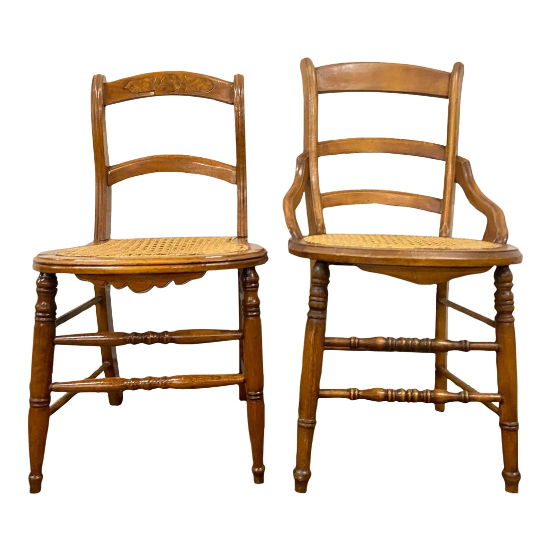 Antique Victorian Eastlake Style Ladderback Cane Dining Occasional Chairs - Pair: This is a stunning pair of antique Victorian Eastlake style Ladderback cane dining chairs or occasional chairs. They are slightly different, adding character. Feature stunningly turned legs, and the c
