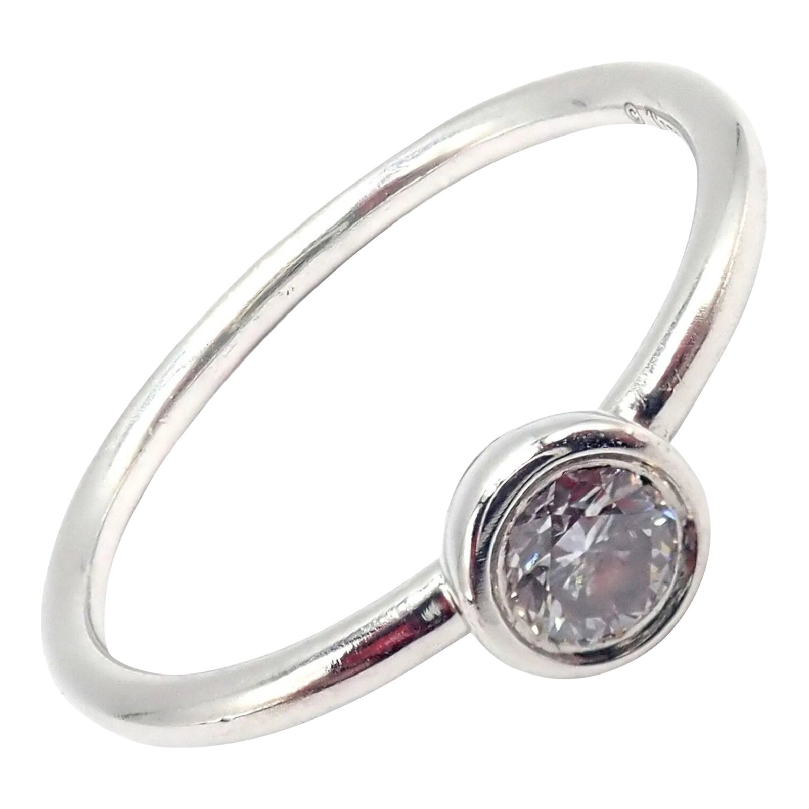 Tiffany & Co. Platinum 0.12ct Diamond Engagement Stacking Ring sz 5.75: This Tiffany & Co. engagement stacking ring, sized 5.75, is exquisitely crafted from platinum and features a 0.12-carat diamond at its center. The design is elegant and understated, perfect for those
