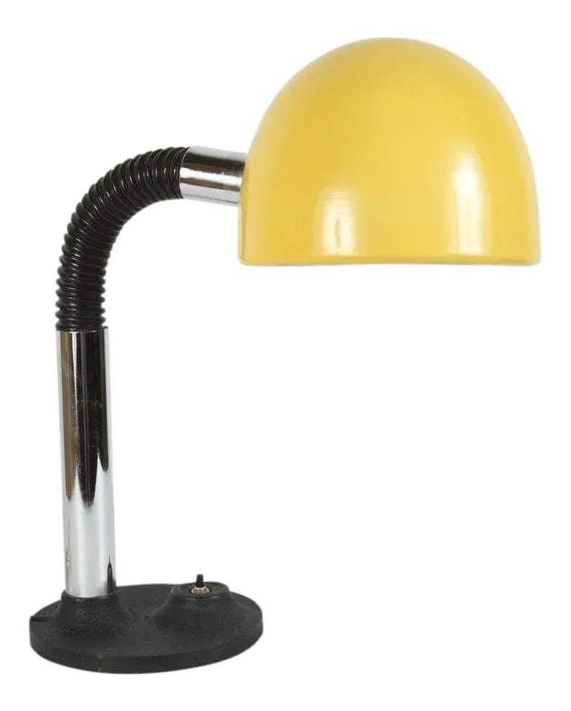 Modernist Enameled Yellow Desk Lamp: Modernist enameled bright yellow gooseneck desk lamp with black iron base. Snake desk style lamp, the tube is flexible and covered in black PVC is adjustable and allows you to direct the light in diff