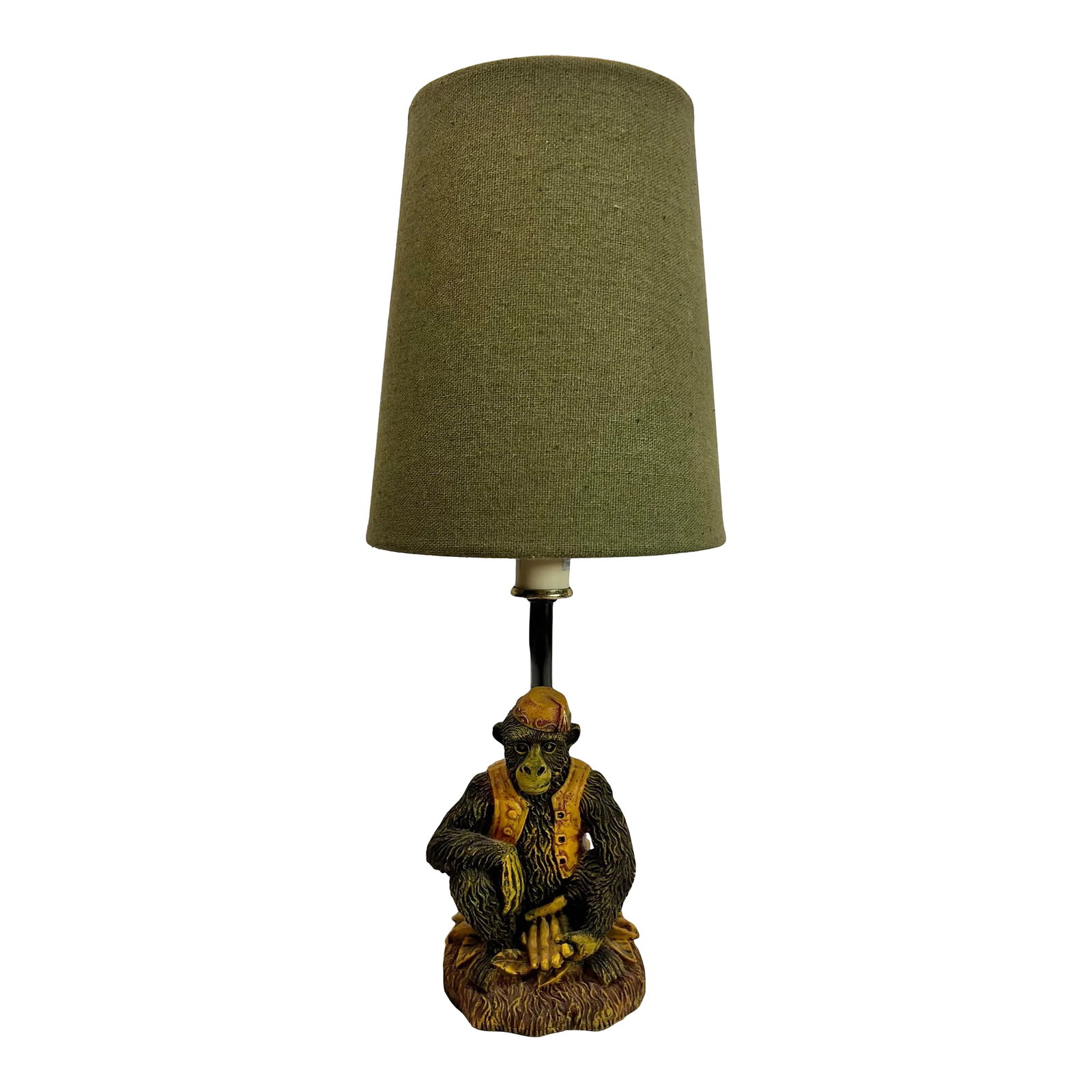 Vintage Bell Hop Monkey Accent Lamp With Green Shade: This Vintage Monkey Wearing Fez Accent Lamp with a green shade is a delightful piece manufactured by CBK in 1999. The charming monkey, adorned with a fez and vest, sits on a bed of banana leaves while