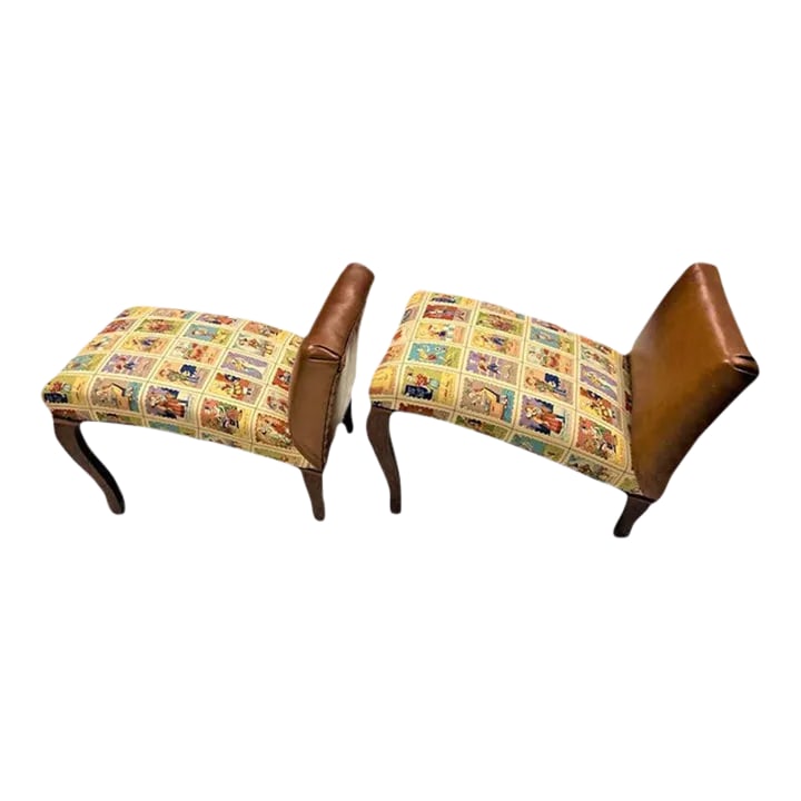 Mexican Loteria Fabric and New Leather Upholstery on Antique Footstools - a Pair: These charming footstools with mahogany legs resemble miniature chaises longues. The Lucia Landa Upholstery team re-imagined and re-did them in fine brown leather with smart nail head trim, and