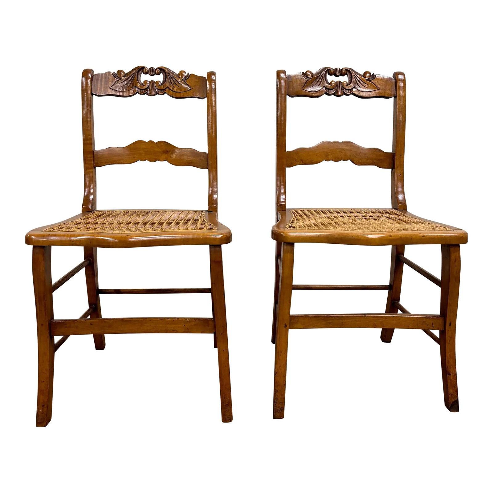 Antique Carved Walnut Ladderback Cane Seat Carved Dining Chairs - Pair: This is a stunning pair of antique carved walnut ladder back cane seat dining chairs or occasional chairs with carved floral tops and handles. Feature stunning legs, and the caning is in excellent con