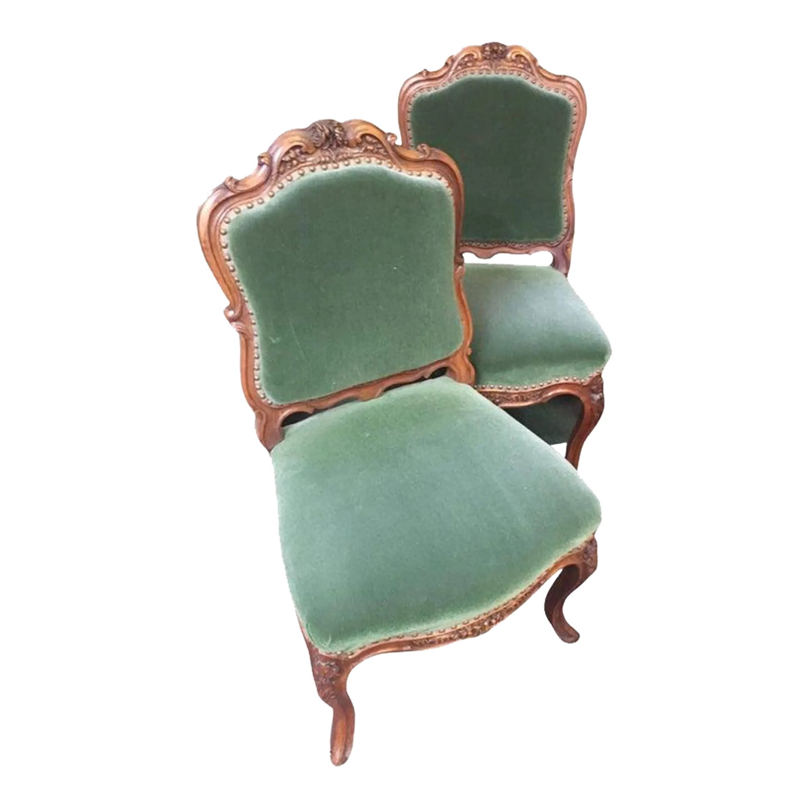 Late 19thc Pair Louis XV Style Upholstered French Fruitwood Chairs: This charming pair of French Louis XV style upholstered chairs are accented at the seats and backs by brass tacking, beautifully carved with foliate and floral motifs and stand on cabriole legs. Notic