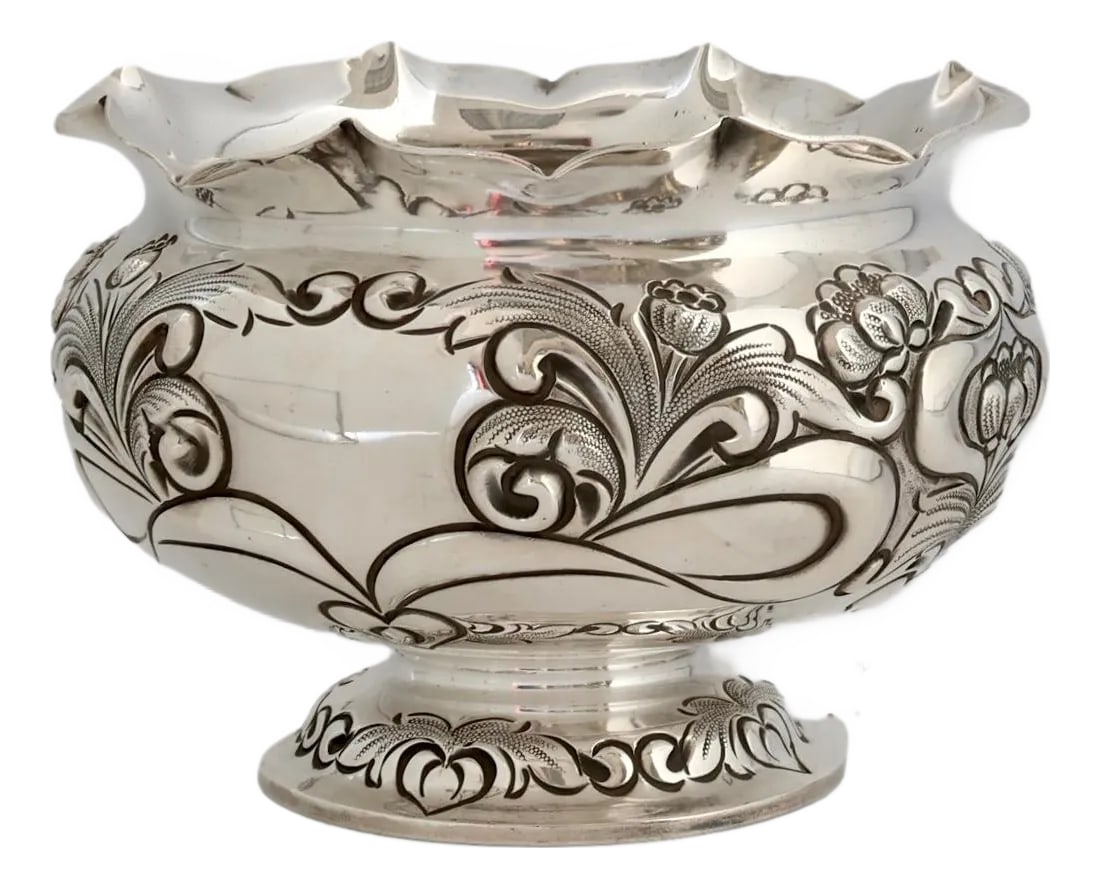 Sheffield Silverplate Hand Repousse Bowl: This silver-plated bowl, attributed to English maker Atkins Brothers (Sheffield, mid to late 1800s), showcases exceptional hand repousse craftsmanship. Intricate floral and scroll motifs are