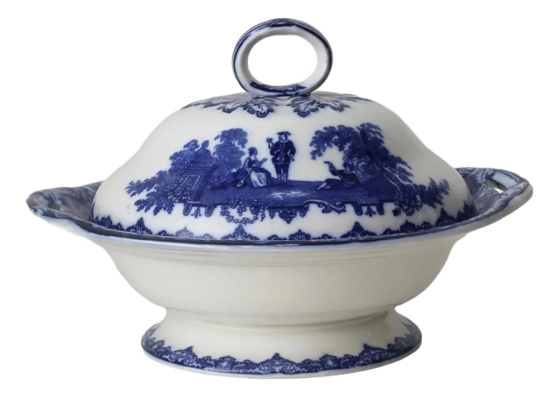 1920s Doulton Watteau Covered Dish: Antique Doulton flow blue comport with lid in the 'Watteau' pattern, circa 1920s. This exquisite piece features romantic pastoral scenes inspired by Jean-Antoine Watteau, framed with an ornate border