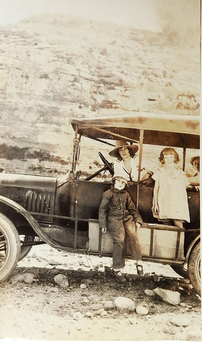 Vintage C. 1915 Adventurous Family Off Road Trip & Roughing It: Vintage circa 1920 snapshot photograph. Young woman and girls in the middle of what looks like a rough off road trip. Custom rig for stowing supplies, open cab. 5 " x 3 ", uneven trimming, corner