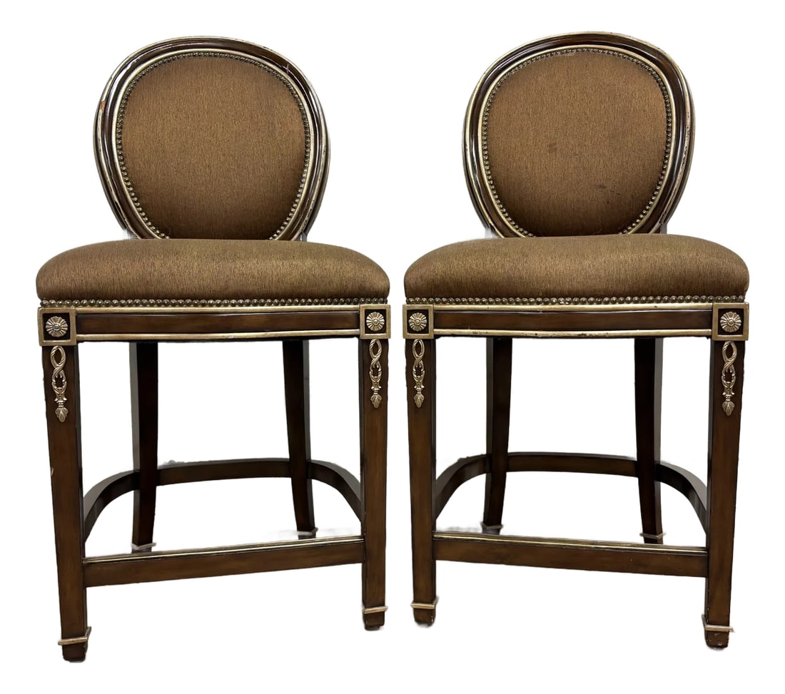 Marge Carson French Louis XVI Style Round Back Bar Stools: This is a gorgeous pair of Marge Carson French Louis XVI style round back bar stools in brown and gold with detailed nailhead trim and gold colored trim details and carvings. Solid, sturdy and comfort