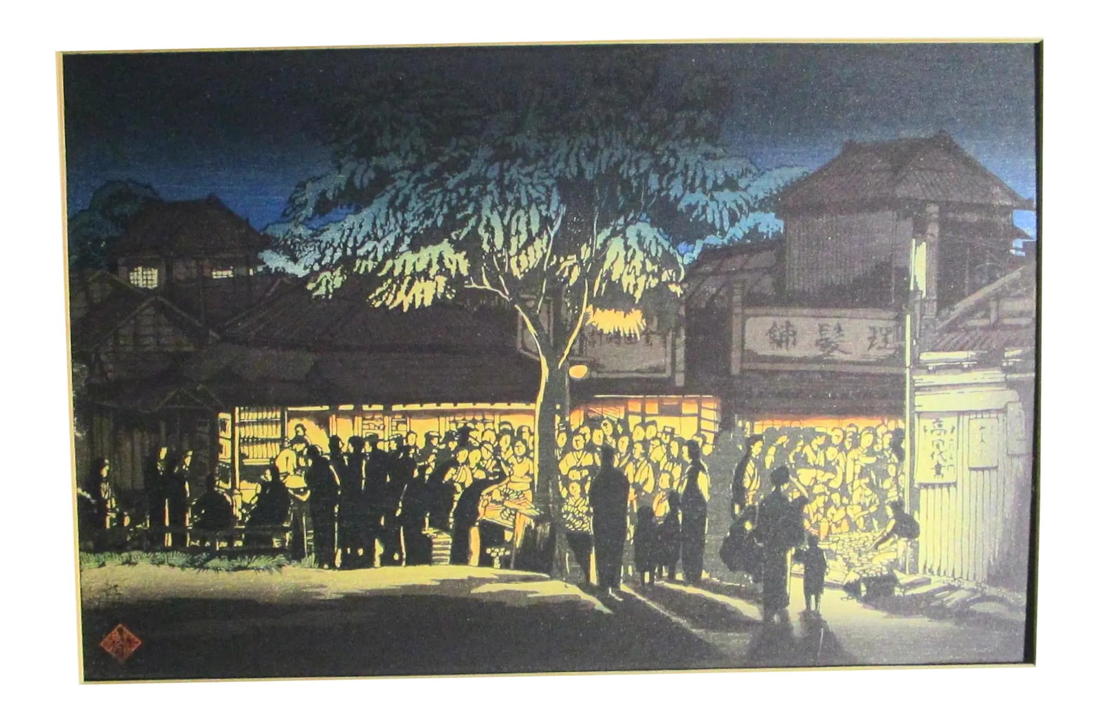 Japanese Woodblock in the Night by Firelight: Crowded gathering in the village by the glow of firelight the large and busy scene is reduced in great style to simple silhouettes under a deep blue night sky. A large statement carrying large visual
