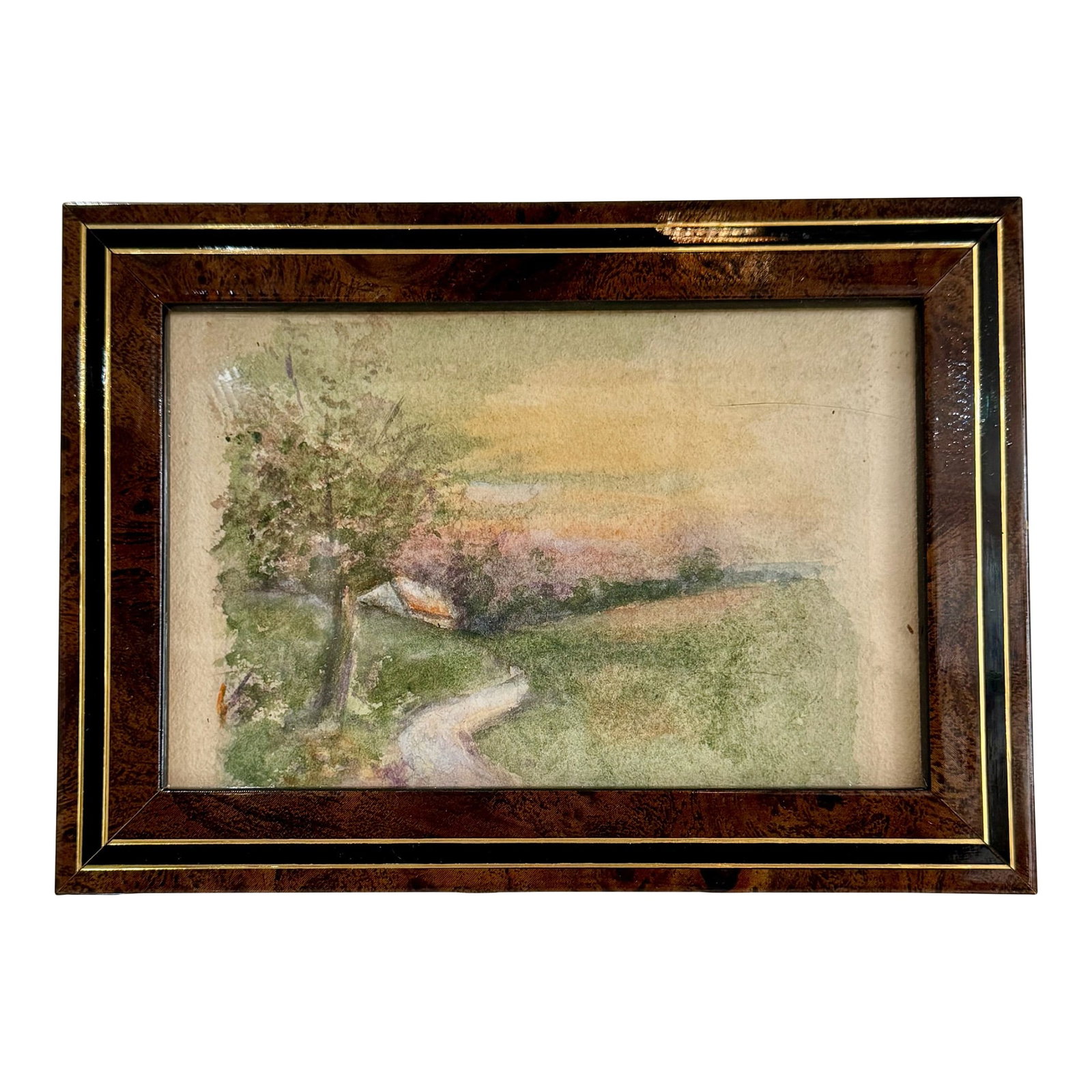 Framed w.c.. Vincent Watercolor Painting of a Country Scene: Delicate original watercolor landscape attributed to W.C. Vincent, capturing a tranquil country road bordered by trees and rolling fields under a soft golden sky. The impressionistic brushwork and