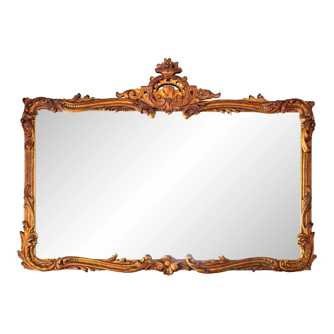 French Antique Carved Gesso Gilt and Wood Overmantle Wall Mirror: This stunning antique French carved gesso, gilt, and wood mirror features ornate scrolls, foliage, florals, and a large central fleur de lis in the crown. Perfectly scaled to strike a balance between 
