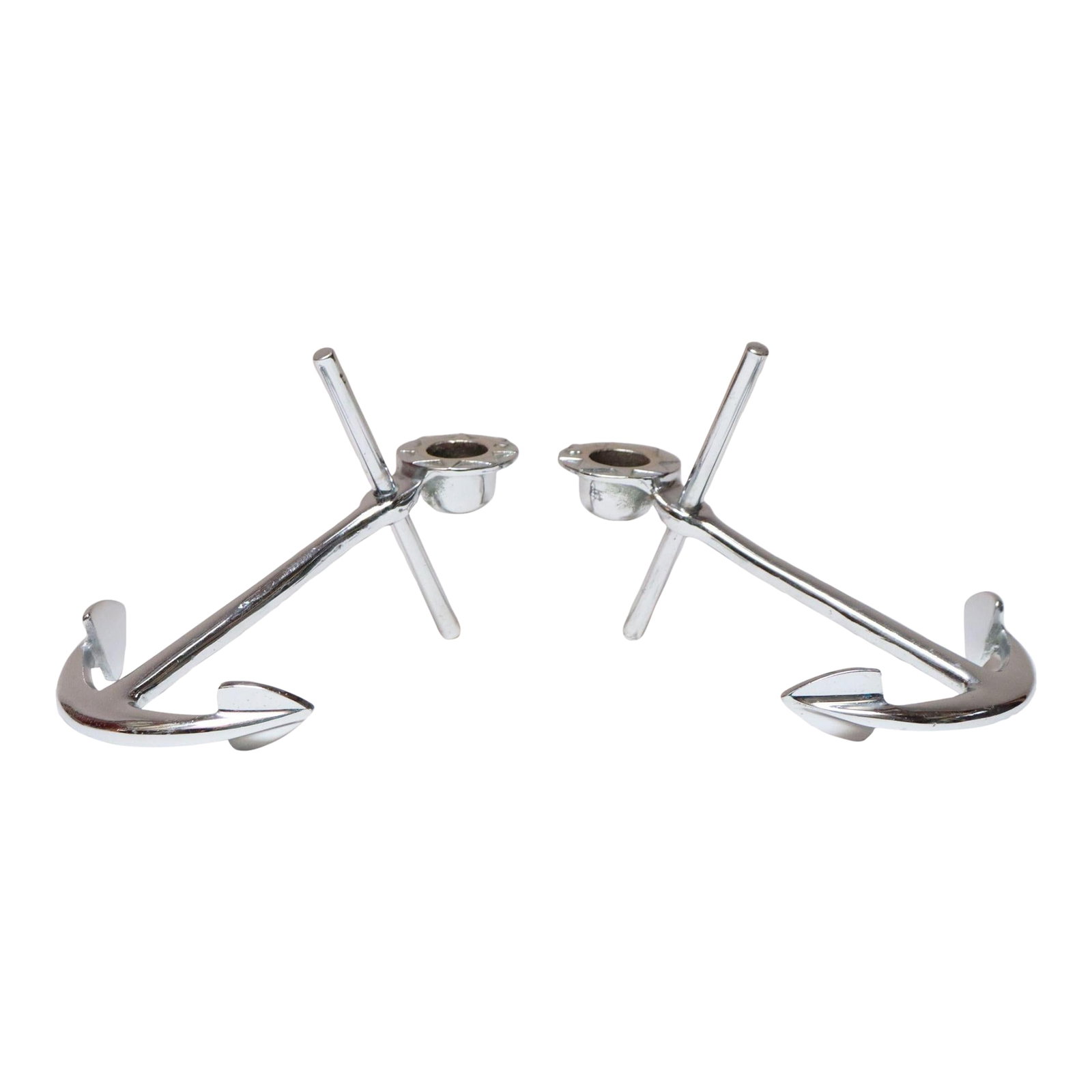 Pair of Vintage Chrome Nautical Anchor Form Candlesticks / Candleholders: Pair of chrome "anchor" candleholders (ca. 1960s, USA). Modernist form - anchors are supported and raised by angled cylindrical dowels, producing a dramatic, sharp line. The bobeche's design features 