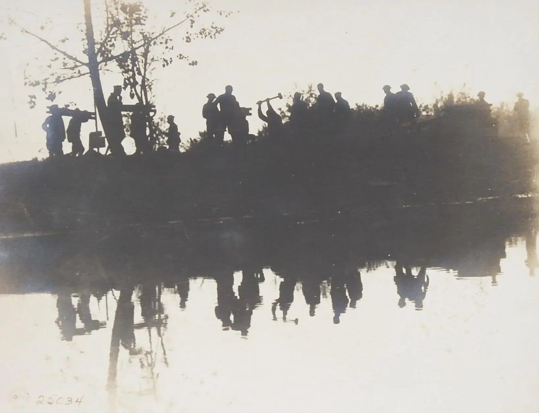 Vintage 1918 Us Army Signal Corps Photograph: Vintage circa 1918 US Army WWI Signal Corpssilver gelatin photograph. Silhouette image of soldiers working on a road or railway with reflection in water. Official marking lower left corner. Unframed,