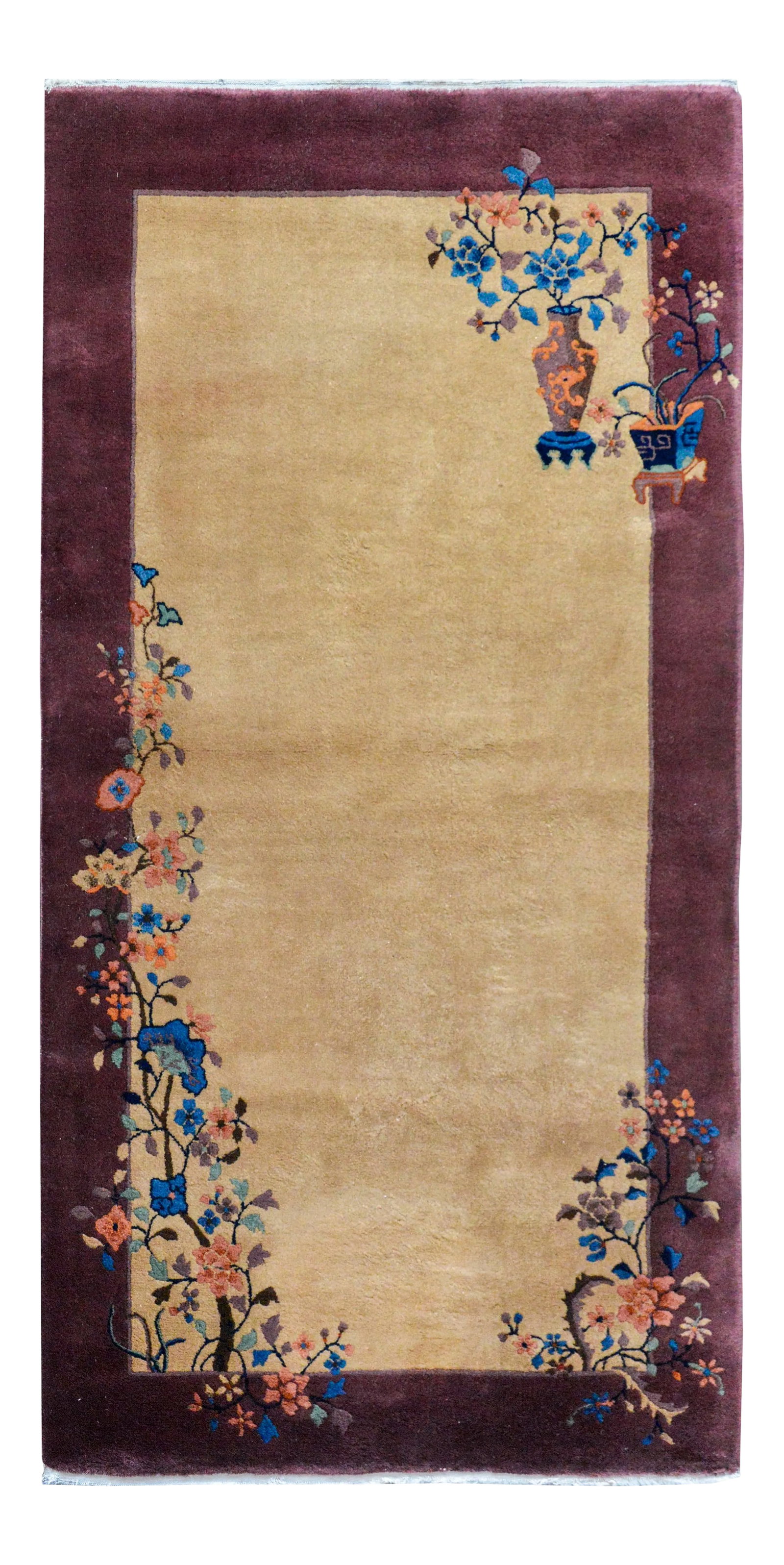 Early 20th Century Chinese Art Deco Rug: A wonderful early 20th century Chinese Art Deco rug with a beautiful solid beige background with a wide purple border, and overlaid with multi-colored auspicious flowers including peonies and cherry b