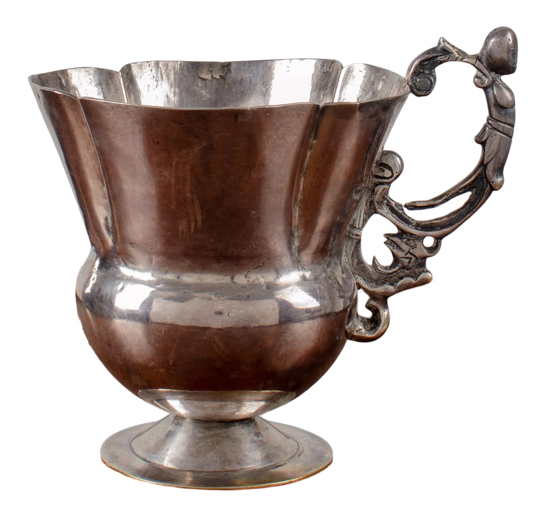 Spanish Colonial Silver Cup, 18th Century: An 18th century Spanish colonial silver cup with lobed rim and female figurehead handle. 5 1/2 inches wide by 4 3/8 inches deep by 4 1/4 inches tall Condition: Alterations: Original Condition