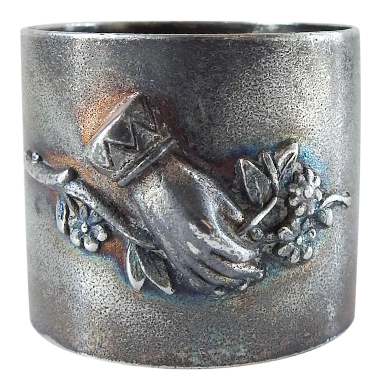 Antique Silverplate Figural Hand Napkin Ring: Antique circa 1890's silverplate napkin ring. High relief hand holding flowers, monomgram FPP. Unmarked, dark overall patina, some surface scuffing. Condition: Alterations: Original Condition Unaltere
