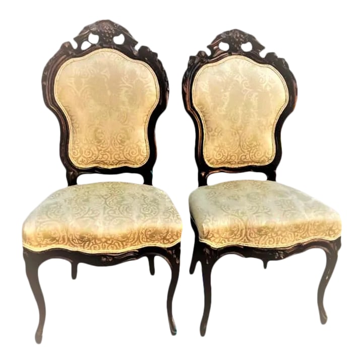Antique Austro-Hungarian Heavily Carved Walnut Side Chairs - a Pair - 19th Century: Superb wood carving on these substantial and elegant 19th Century Austro-Hungarian Empire chairs. Completely restored with new springs and cushions and reupholstered a few years ago in luxury fabric w