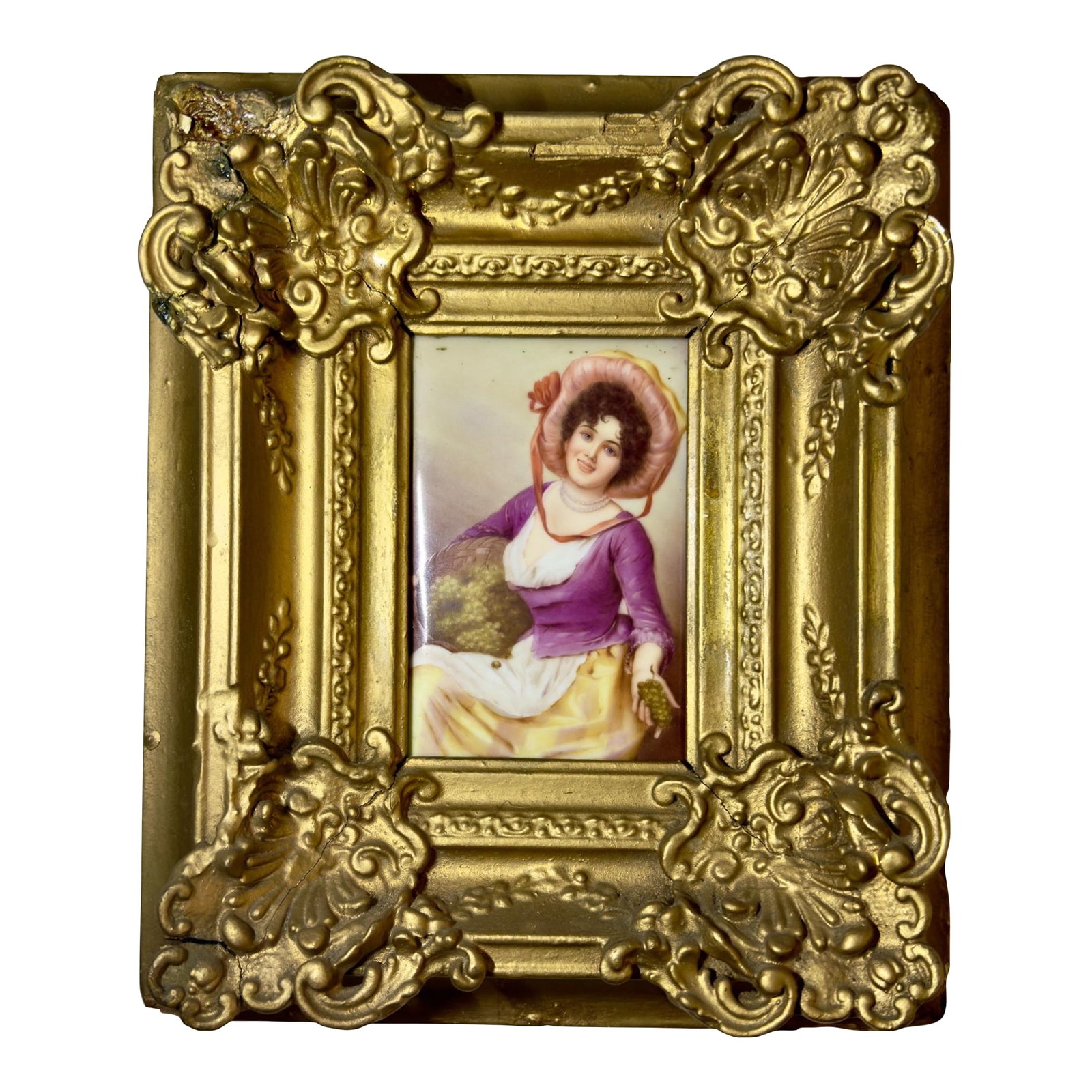 Antique German Porcelain Portrait: Beautiful antique painted porcelain portrait plaque depicting a young woman. The painting is house within an ornate, Baroque-style Italian wood and gesso frame featuring heavy gilding. Manufactured