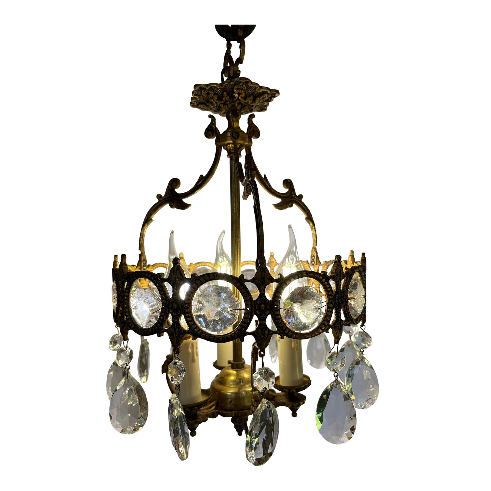 Vintage 1950's Italian Cage-Style Chandelier: This light is a vintage cage-style chandelier, dating from the 1950's. It's design is characterizered by a central brass cage frame with ornate scrolling and a series of hanging fauceted crystal drops