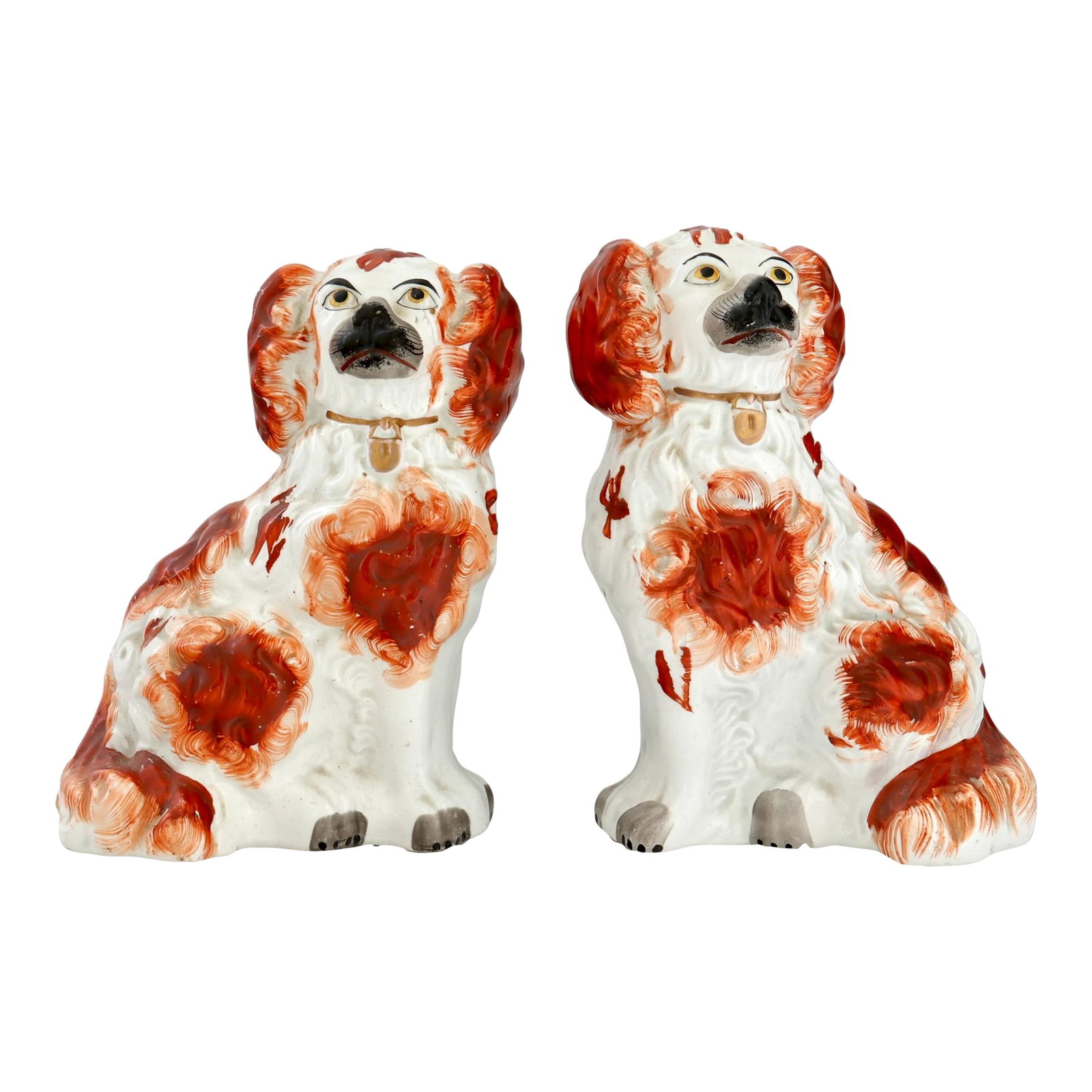 Antique Staffordshire King Charles Dogs / Spaniels, a Pair: Mid 19th century Staffordshire pottery King Charles spaniel dogs modeled in the traditional seated form with expressive faces and hand-painted red and white decoration. Well-proportioned and comfortab