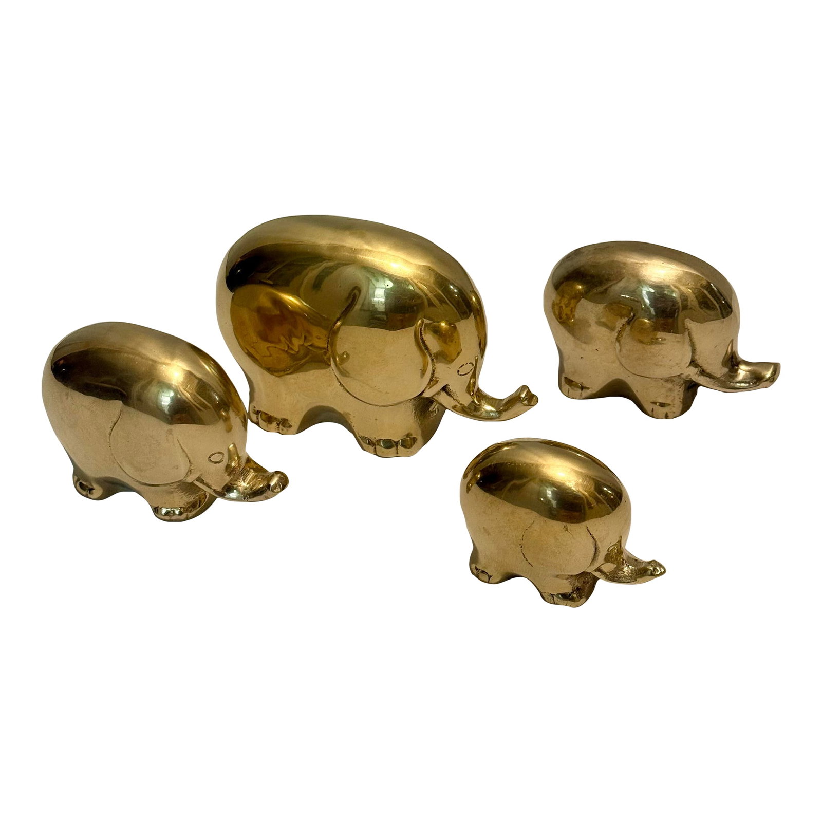 1970s Hollywood Regency "Pudgy" Brass Elepant Family Paperweights - Set of 4: This charming "family" of four graduated elephants is the epitome of Hollywood Regency playfulness and Palm Beach sophistication. For this set, Turtle and Crane has moved away from our signature paint
