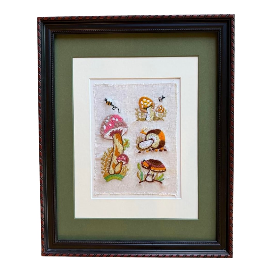 Mid 20th Century Framed Mushroom Textile Art Needlepoint Collage Folk Art: Offering a vintage mid-century folk art mushroom collage in hand-embroidered needlepoint. It had been framed showcasing its vintage charm and character leaving the textile raw edges. Framed under