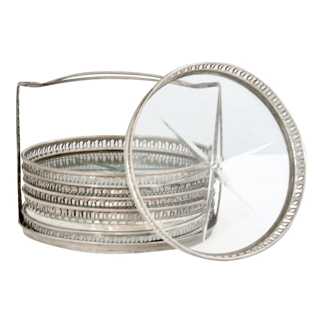 Sterling & Cut Crystal Coaster Set: Early 20th-century American sterling-silver and cut-crystal coaster set with pierced rims and etched star centers. The silver retains a warm patina from age, while the crystal remains bright and clear