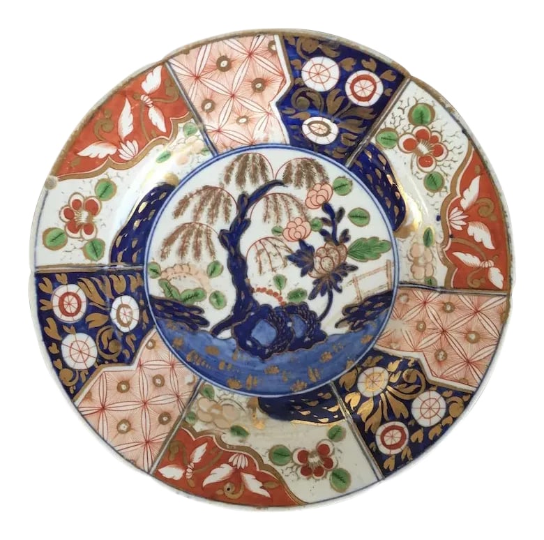 Early 19th Century Coalport Porcelain Imari Rock & Tree Dinner Plate: Antique Coalport porcelain imari dinner plate decorated in the rock and tree pattern made famous by the Prince Regent at Brighton Pavilion and found today in the Royal collection at Buckingham Palace.