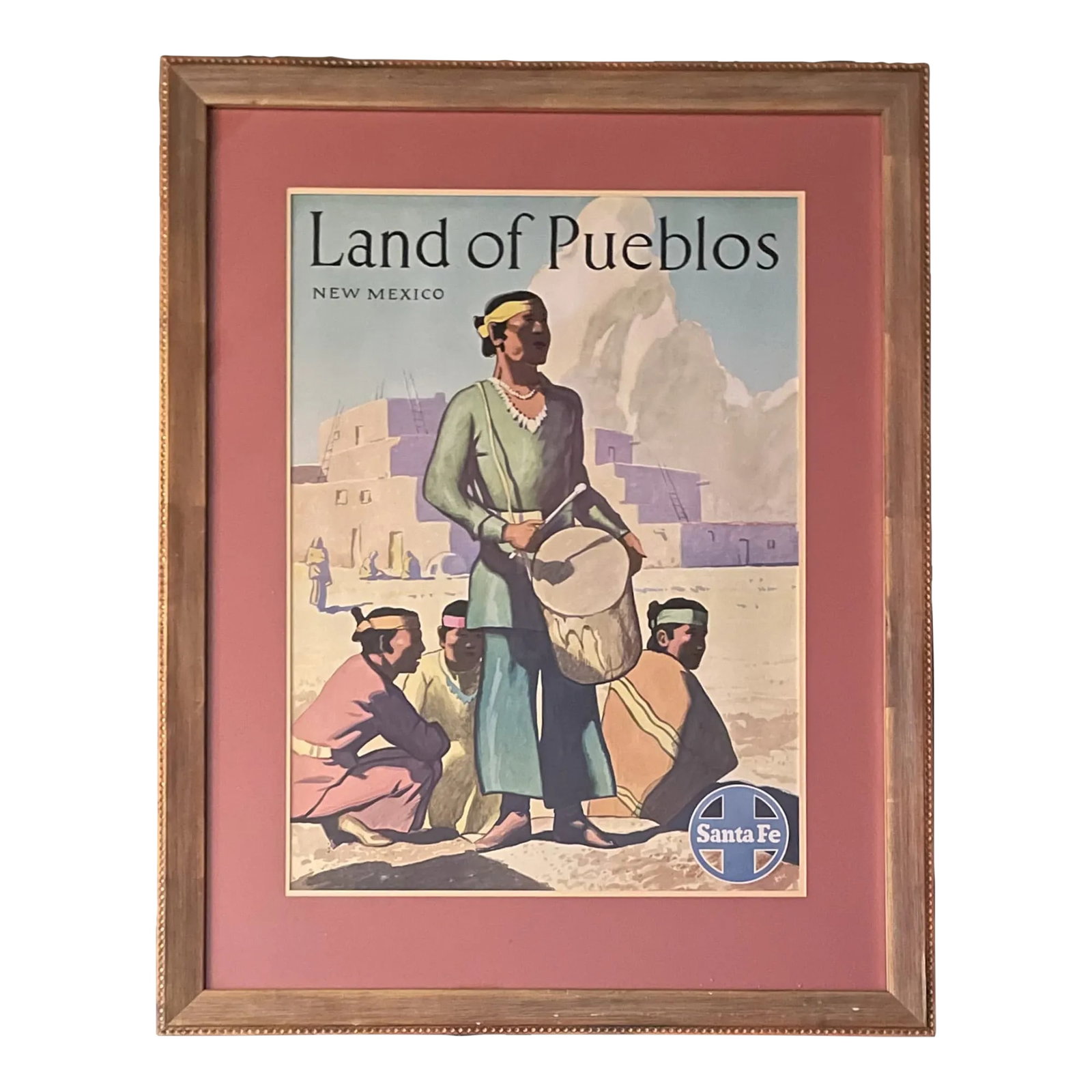 1940s Original Land of Pueblos Poster: This is a vivid example of a mid-century vintage poster titled "Land of Pueblos," made to promote tourism throughout American Southwest for the Santa Fe Railway. The scene features a group of Native