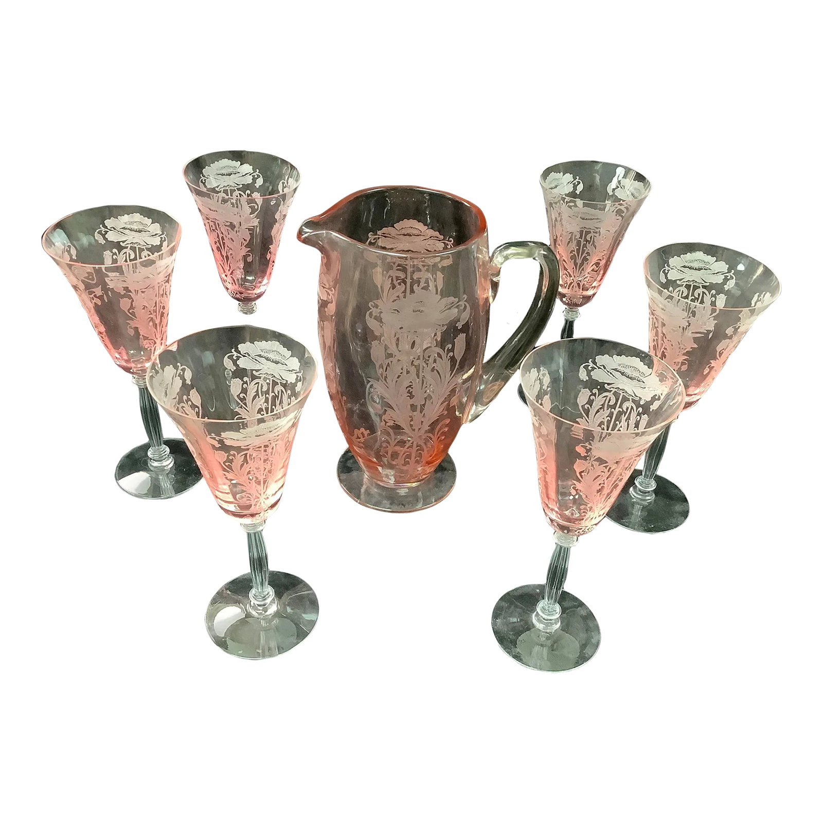 Tiffen Flanders Etched Pink Water Pitcher With Six Glasses: Elegant Vintage Tiffen Flanders Water Pitcher with six long stem water glasses. Beautiful floral etchings on pale pink coloring. in Very good condition, three glasses have fleabite chips on rim. Dimen