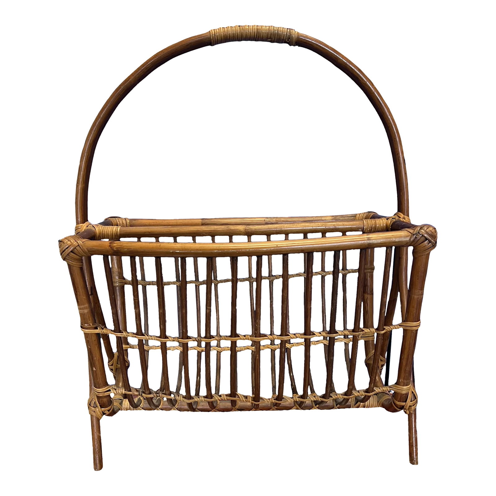 MidCentury Modern Rattan Magazine Rack: Mid Century modern rattan magazine rack in rich brown with lighter woven accents. Condition: Alterations: Original Condition Unaltered Imperfections: Some Imperfections Condition Notes: In very cold c
