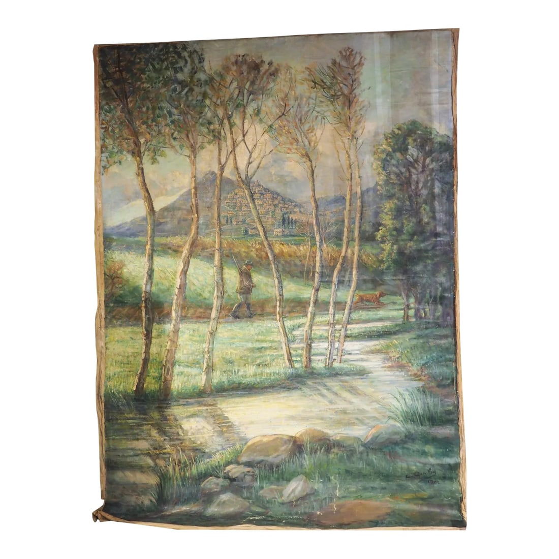 Large French Landscape Painting of a Hunter and Hillside Village, Signed and Dated 1962: Purchased from a chateau in the South of France, this large landscape painting of a hunter walking outside of a hillside village is over 10 feet tall and seven feet wide. The canvas is signed and