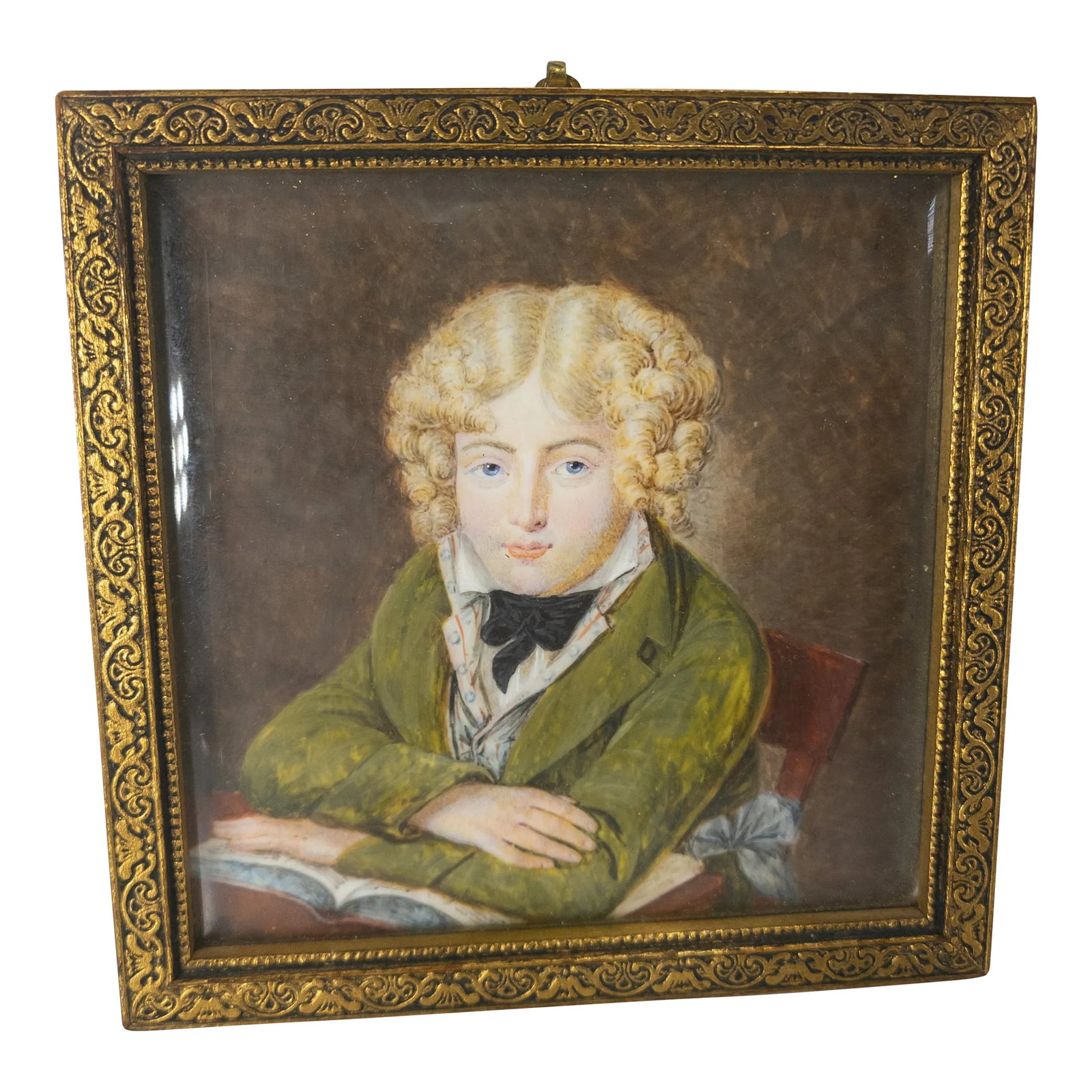 19th Century French Miniature Watercolor Portrait Painting of a Boy After Daniel Saint: We are selling this finely painted miniature portrait of a boy. This portrait appears to be after Daniel Saint (French 1778-1847) and features a young boy well dressed posed over an open book. The