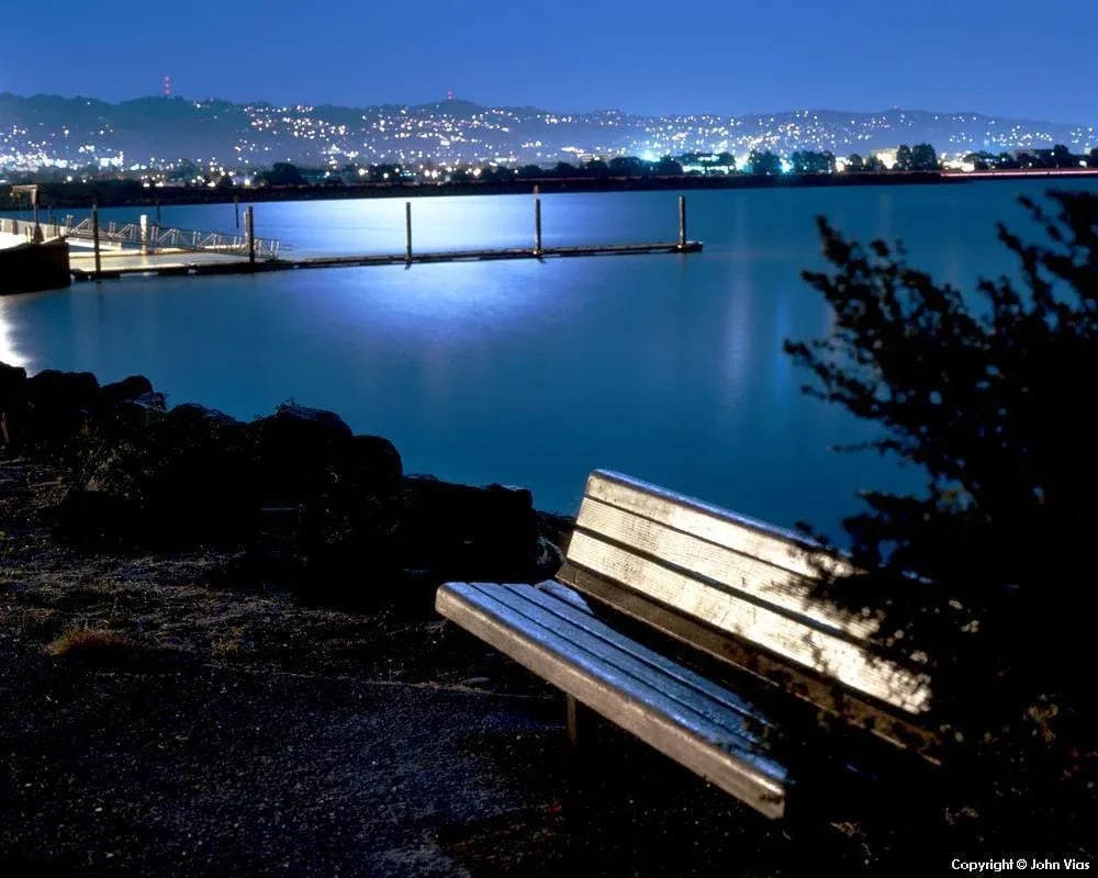 Contemporary Night Photograph "Moonlit Bench" by John Vias: Beautiful contemporary color photograph of a moonlit bench by John Vias. Truly poignant, this image will look wonderful in your bedroom or living room! Note from the artist, John Vias: "I was out