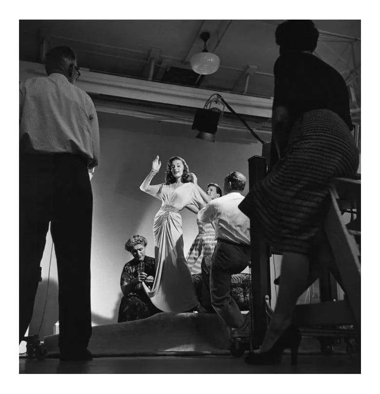 Elaine Stewart Being Photographed by Ray Jones 1953. Photo by Sid Avery: Elaine Stewart being photographed by Ray Jones, 1953. 11" x 14" silver gelatin fiber based print signed on verso by the photographer, Sid Avery. Edition #11 out of 70. Condition: Imperfections: No
