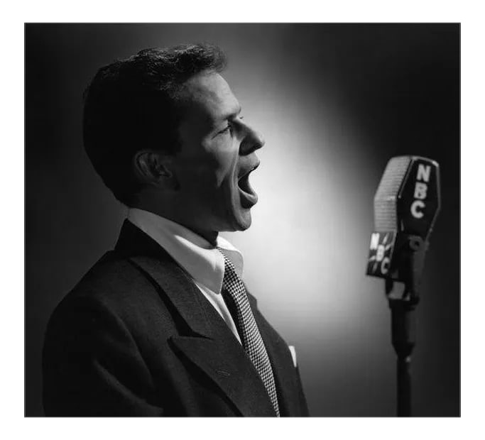 Frank Sinatra Circa 1945: Frank Sinatra circa 1945. Photo by Paul Hesse. 11" x 14" silver gelatin print. Printed later under the direct supervision of Sid Avery and signed on verso by Sid Avery. #02 of an open edition. Conditi