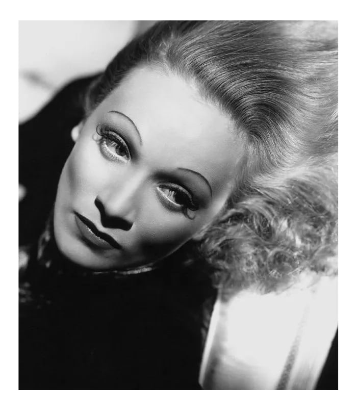 Marlene Dietrich 1937: Marlene Dietrich on the set of "Angel" in 1937. Photo by Don English. 11" x 14" silver gelatin print. Printed later under the direct supervision of Sid Avery and signed on verso by Sid Avery. #01 of