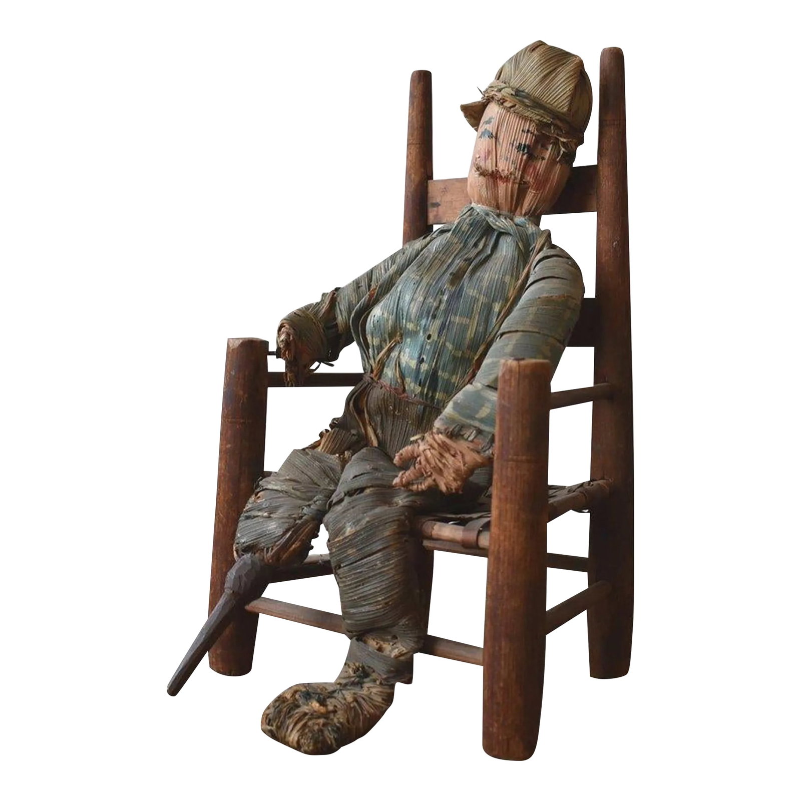 Hand-Painted Corn Husk Seated Man With Carved Wood Peg Leg, Circa 1940s: Hand-Painted Corn Husk Seated Man With Carved Wood Peg Leg, Circa 1940s. This atypical corn husk figure is detailed down to its individual fingers, suspenders and carved peg leg. The surface of this f
