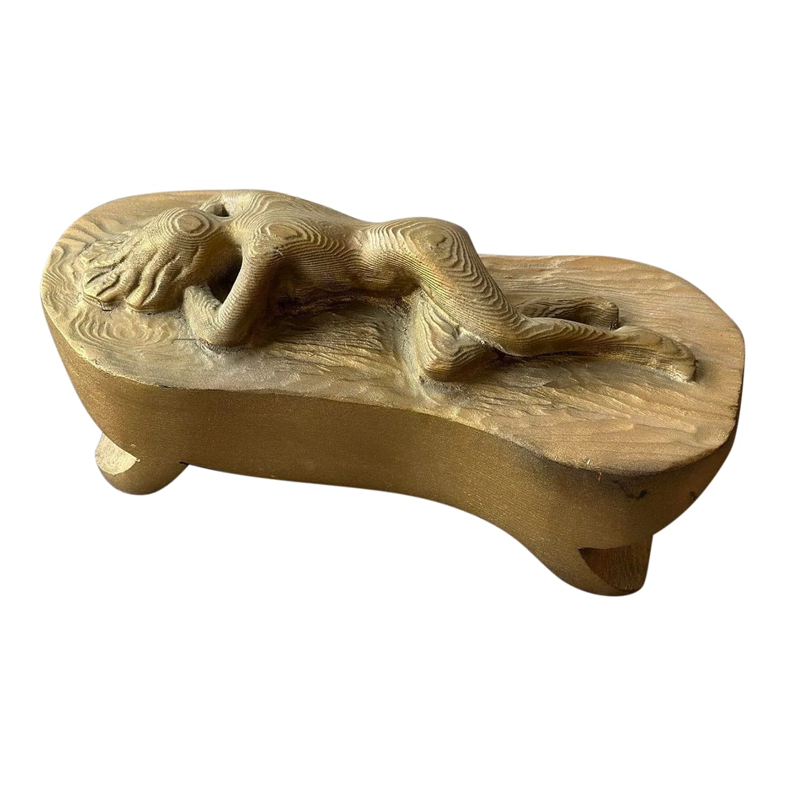 Vintage Gold-Painted Carved Wood Nude in Repose, Circa 1950s: Vintage Gold-Painted Carved Wood Nude in Repose, Circa 1950s. Carved from a single piece of wood in the round, this nude form rests atop a platform base resembling a bed. The figure's arms are folded