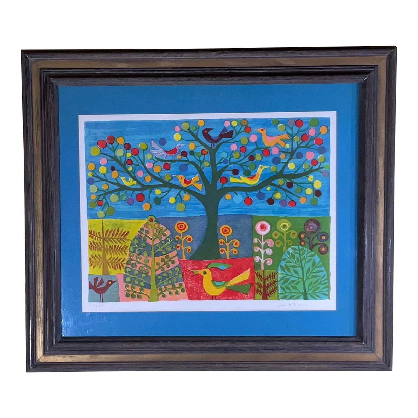 Signed Whimsical Lithograph by Judith Bledsoe: This vibrant lithograph depicts a whimsical scene of nature. A colorful tree, adorned with apples and birds, stands at the center of the composition. The tree is surrounded by a diverse array of plant