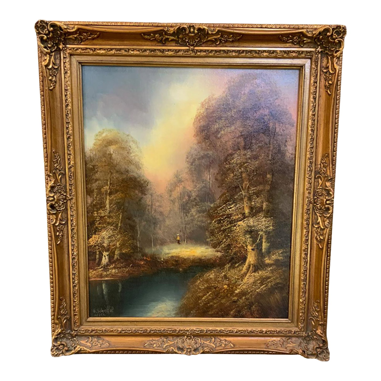 Vintage Signed Romantic Landscape Oil Painting in Ornate Gilt Frame: Atmospheric vintage oil painting depicting a wooded landscape surrounding a tranquil pond, with a solitary figure in the distance. Richly layered trees, luminous sky and reflections on the water
