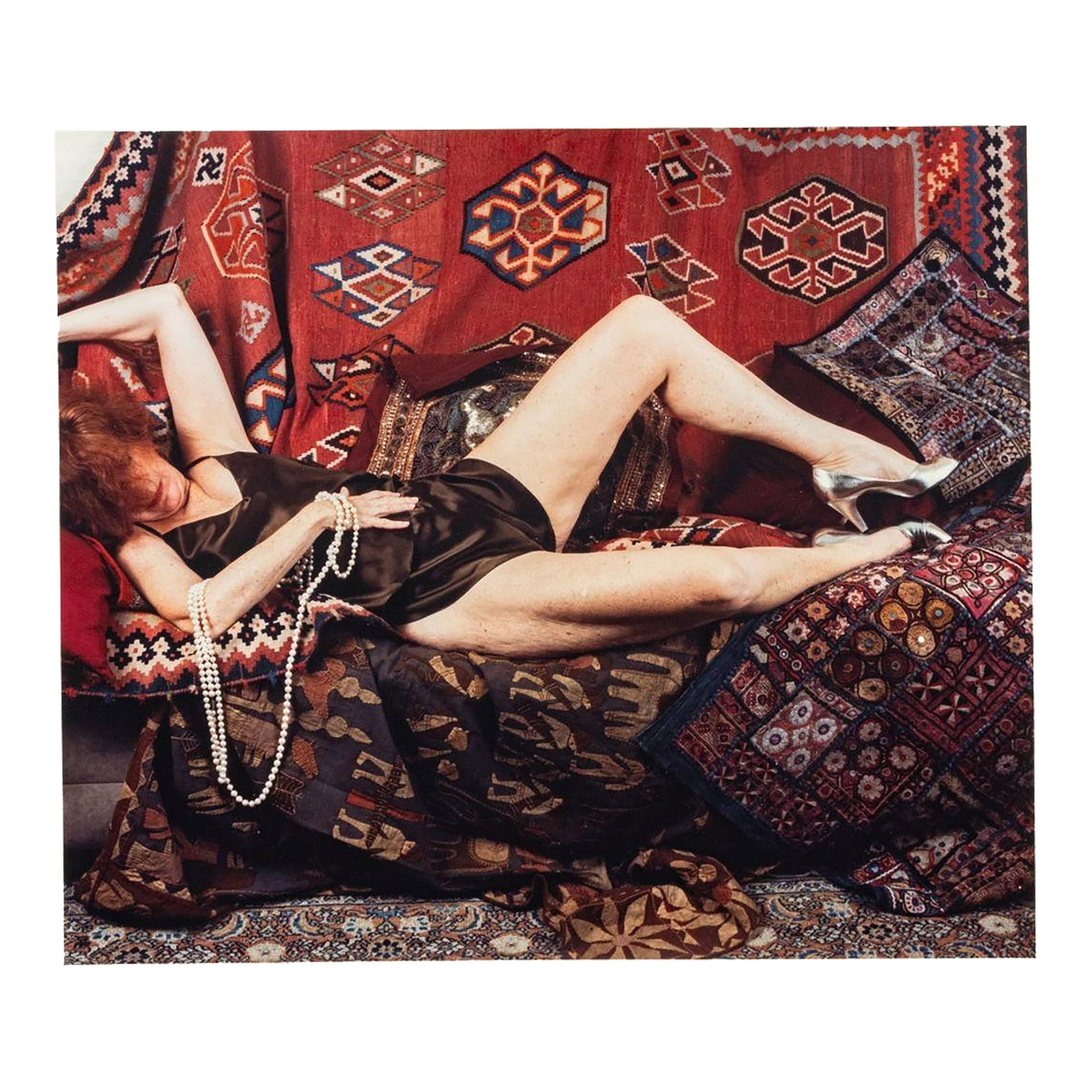 Anne Sager Reclining Female Figure Photo C-Print: Anne Sager (American, 1930-2024), Reclining Female Figure, Color Photograph, Chromogenic Print, from the "Women Over 50" series, woman in lingerie, lounging on patterned rugs, stamped "Anne Sager 19" 