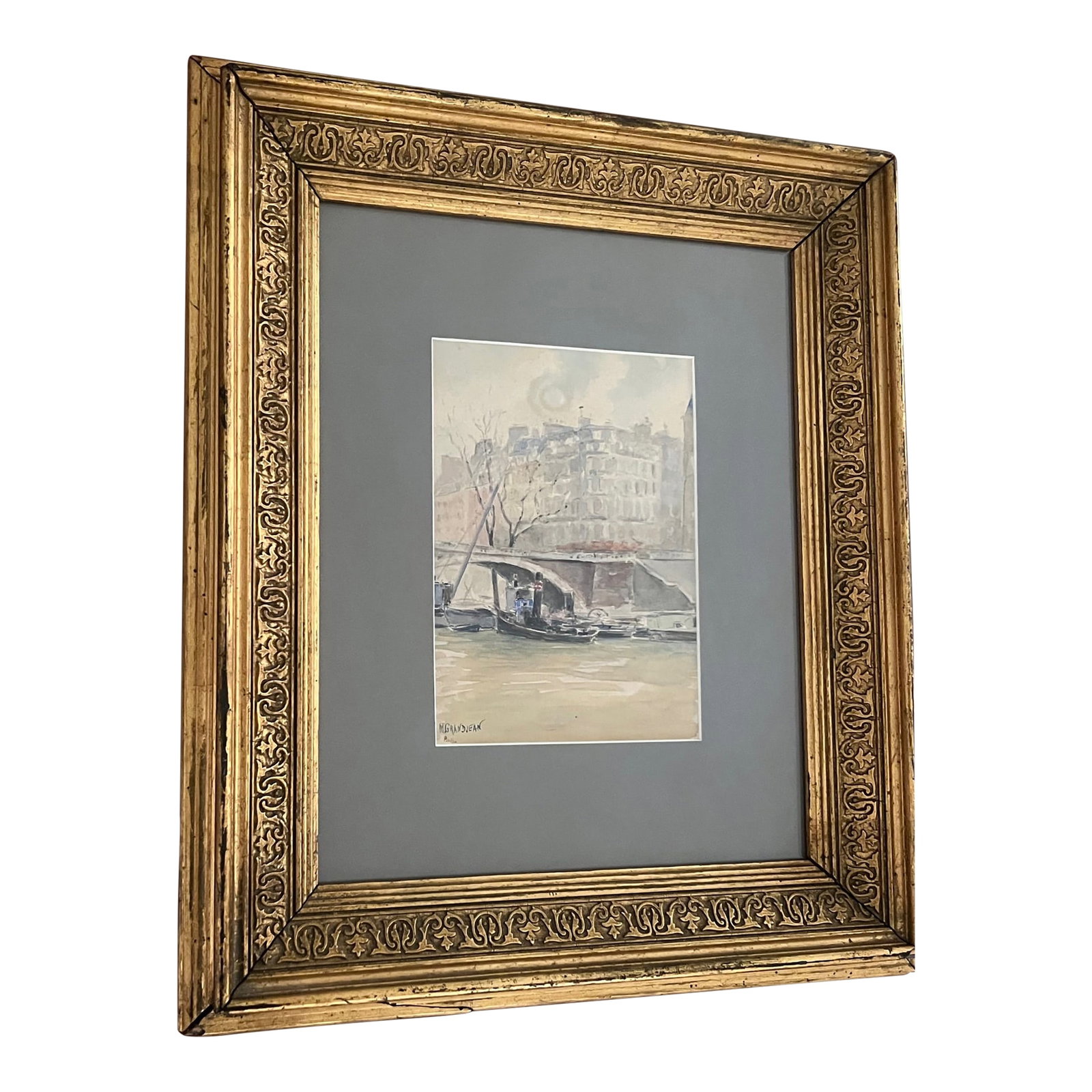 Paris Watercolor by Grandjean in Antique Frame: A watercolor of a view from the Siene river looking toward the Pont-Louis Philippe bridge in Paris. Painted in the mid century and signed by the artist M. Grandjean, framed in a wood carved antique fr