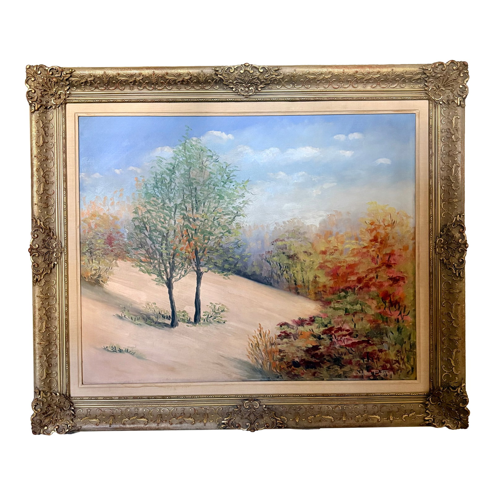 Late 20th Century High Desert Landscape Oil on Canvas, Signed by Artist: This original oil painting by artist E. Wilson Putnam depicts a high desert or arid landscape with rolling hills, blue skies and two trees. Housed in an ornate, gold toned wood frame, the painting is