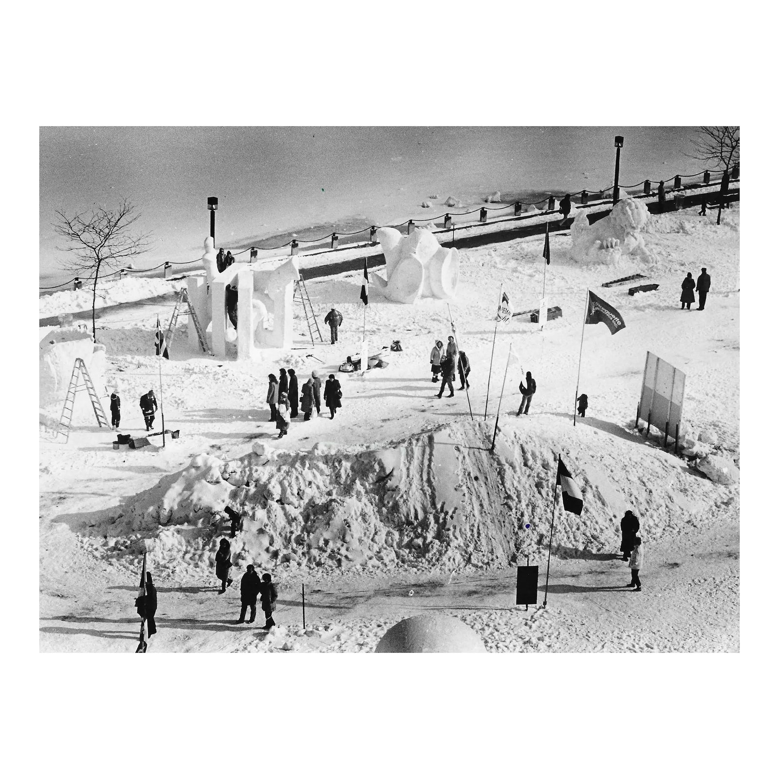 1987 Michigan Snow Sculpture Black & White Photograph: 1987 photo of a snow sculpture competition in Pere Marquette Park in Michigan. Publication information on the back. Condition: Alterations: Original Condition Unaltered Imperfections: Some